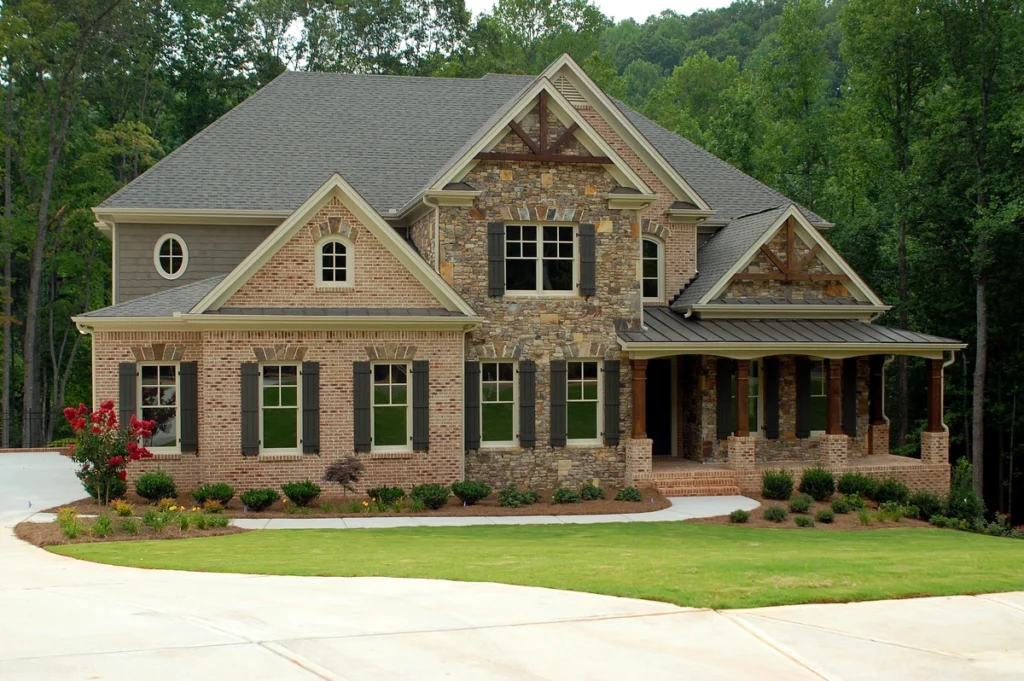 large brick house exterior with new roof